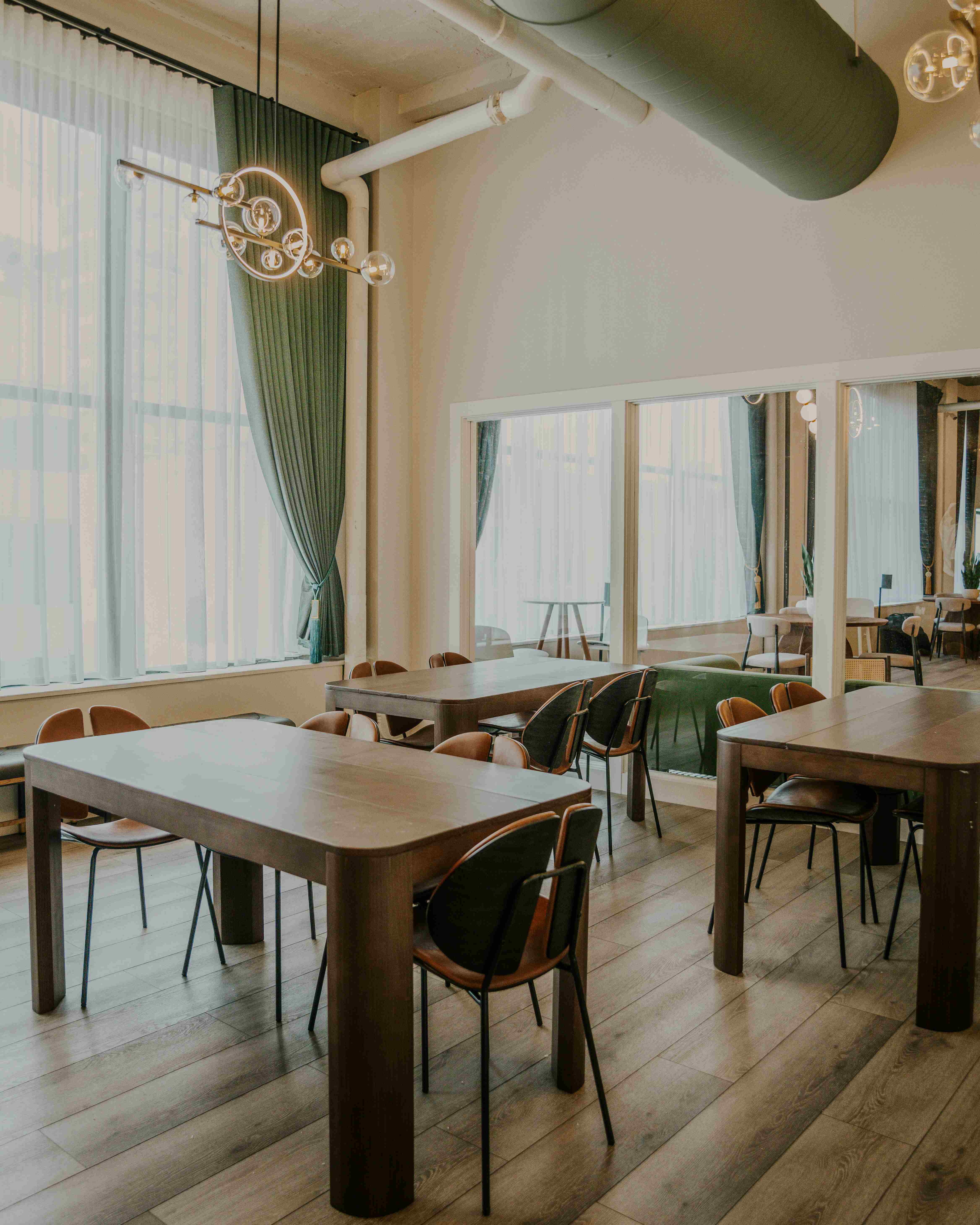 Co-working space with wooden tables and modern lighting